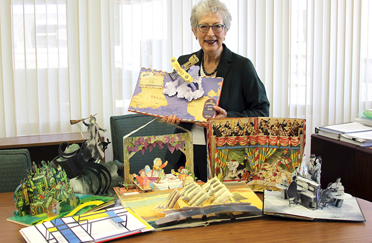 Glenda Thornton with with some of the pop-up books in her collection 