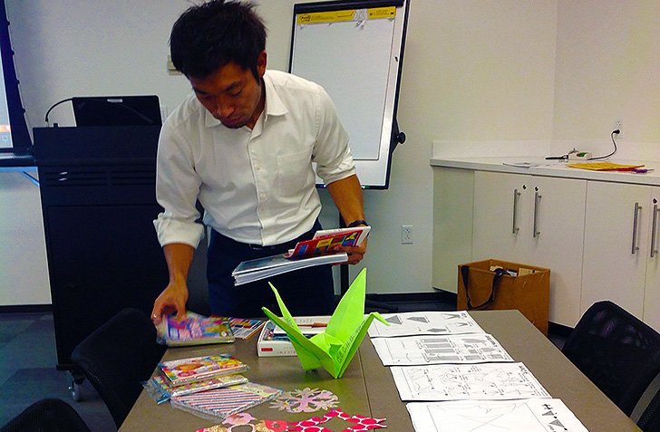 Haruhide Osugi of the Japan Outreach Initiative demonstrates origami